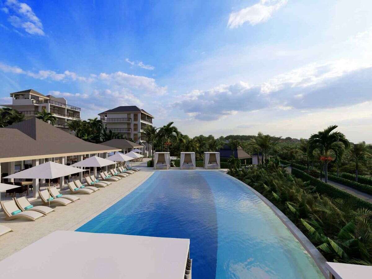Antigua & Barbuda beach resort with swimming pool and beach chairs
