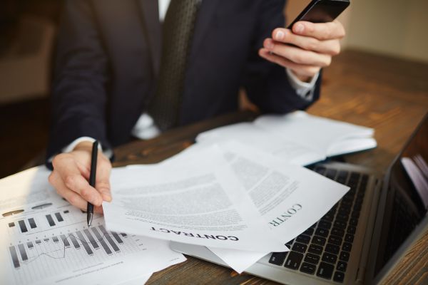 Investor reading contract to open an offshore account