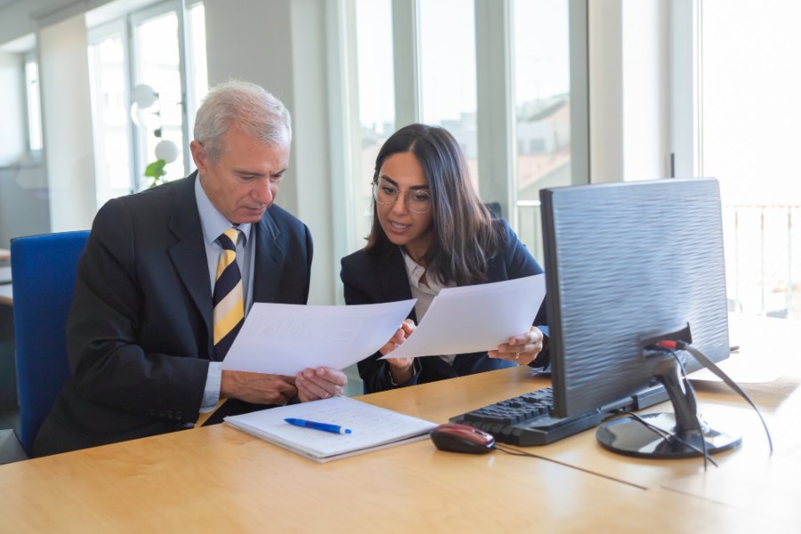Executives reviewing their offshore company's compliance with regulations